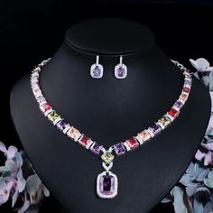 Complete your wedding look with this elegant Bridal Necklace and Earring Jewelry Set. The set is designed to add a touch of sophistication and style to your bridal ensemble, making you shine on your special day.
– This bridal a plus cubic zirconia gemstone necklace set is perfect for adding elegance to any bridal ensemble.– Made with high-quality materials, this set includes a stunning necklace and matching earrings for a complete look.– Perfect for pageant, bridal, bridesmaid, prom, quinceañera African Style Necklace, Purple Jewelry Set, Prom Jewelry Sets, Engagement Necklaces, Diamond Jewelry Set, 18k Gold Necklace, Purple Jewelry, Prom Jewelry, Zircon Jewelry