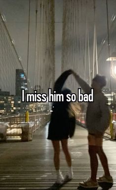 two people standing on a bridge with the words i miss him so bad