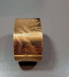 gold tone cuff bracelet with a floar tropical design this is a wide bracelet from the 1970's glorious wide gold tone cuff bracelet textured metal finish looks as if the design is etched the bracelet is somewhat flexible this fits up to a 7 inch wrist this is gold tone base metal this is a used, vintage item it is not a new item20 % restocking fee! Chunky Cuff Bracelet, Cuff Bracelet Gold, Vintage Floral Design, Art Deco Bracelet, Wide Cuff Bracelets, Hippie Bracelets, Gold Armband, Wide Bracelet, Gold Bracelet Cuff