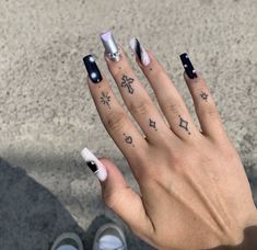 a person with some tattoos on their fingers