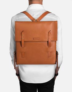 Modern minimalism has never been more accessible with the Stanton backpack, made for every journey. The Santon leather backpack is made from premium Italian leather, adjustable bridle leather straps, double strap/stud closure and a removable laptop sleeve, and interior zip pocket. Available for men and women. Classic Cognac Backpack For Travel, Classic Cognac Travel Backpack, Cognac Backpack With Leather Lining For Travel, Travel Backpack With Leather Lining In Cognac, Cognac Travel Backpack With Leather Lining, Cognac Backpack With Leather Backing For Travel, Cognac Leather-backed Backpack For Travel, Everyday Cognac Backpack With Leather Lining, Cognac Leather Standard Backpack