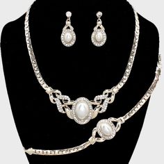 Beautiful Rhinestone Crystal And Pearl Accented 3 Piece Style Bracelet , Necklace And Earrings Statement Fashion Jewelry Set Necklace Size: 16" + 3" L Decor Size: 1" L Bracelet Measures: 3/4" H ; 7" L Dangle Earrings Size: 1 1/4" L Color: White , Silver , Clear Theme: Pearl C 15583 N Elegant Alloy Necklaces For Evening, Elegant White Alloy Necklace, Elegant White Alloy Necklaces, Elegant Rhinestone Jewelry Sets For Formal Occasions, Elegant Diamond White Jewelry Sets With Rhinestones, Formal Rhinestone Alloy Jewelry Sets, Elegant Evening Jewelry Sets With Rhinestones, Formal Alloy Jewelry Sets With Rhinestones, Elegant Alloy Jewelry