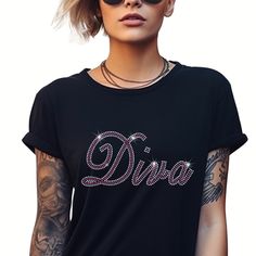 Elevate your style with our Rhinestone Diva T Shirt crafted from premium ringspun cotton for unmatched comfort and durability. Adorned with sparkling rhinestones, this T Shirt exudes wisdom and confidence. Embrace your inner strength while enjoying the softness and quality of our meticulously designed garment.  Size of Design  Width - 9.02 inches Height - 4.05 inches NOTE TO CUSTOMER'S *  All UK and International orders are dispatched tracked and signed. All T Shirts are made from 100% ring spun Graphic Tee With Rhinestones And Crew Neck, Rhinestone Cotton Crew Neck T-shirt, Cotton T-shirt With Rhinestones And Short Sleeves, Black Cotton T-shirt With Rhinestones, Cotton T-shirt With Rhinestones Short Sleeve, Cotton Short Sleeve T-shirt With Rhinestones, Cotton Glitter Print T-shirt, Rhinestone Graphic Tee, Tshirt Crafts