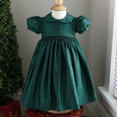 This Strasburg Emerald Green Dress Size 12 Months Is Most Gorgeous!!! Tag Reads 12 Months But Will Accommodate 18 Months Due To Strasburg's Generous Sizing (See Measurements Below). Made Of 100% Luxurious Dupioni Silk -Made Of Black And Deep Emerald Green Silk Strands Which Are Cross-Threaded To Create A Deep Luxurious Color In The Folds And On The Dress From Different Angles Of Light .Smocking At Waist With Hand Embroidery Emerald Rosettes With White Pearls In Between. Sweet Peter Pan Collar Th Green Holiday Dress, Yellow Formal Dress, Emerald Green Dress, Deep Emerald Green, Heirloom Dresses, Floral Dress Formal, Emerald Green Dresses, Cotton Slip, Dupioni Silk