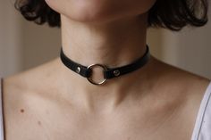 Genuine black leather choker. Made from firm 1.6 mm thick and 10mm width leather. Secured with snap buttons. If you want a different length just add it in comment section when placing your order. How to measure your neck: If you don't have a seamstress tape measure, take a piece of yarn or string and wrap that around your neck to a comfortable fit marking the point where the end touches itself. Lay the string straight next to a ruler and note the length. A choker should sit comfortably around yo Unique Choker, Leather Choker Collars, Black Leather Choker, O Ring Choker, Choker Handmade, Lingerie Vintage, Book Necklace, Heart Choker, Ring Der O