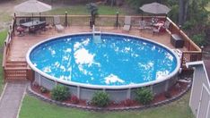 an above ground swimming pool surrounded by lawn furniture