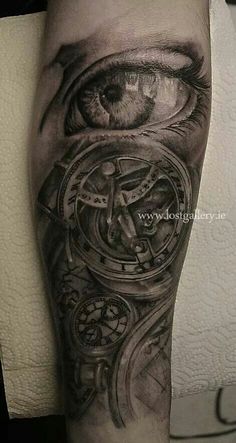 a man's arm with an eye and clock on it