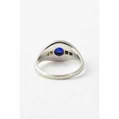 Art Deco platinum ring featuring an oval sapphire mounted with two diamonds on each side. US size 7.25; can be sized. Acid tests platinum, unmarked. The approximate weight of the stones is .50 carats for the sapphire and .16 carats for the diamonds. Age wear, light scratches on platinum and sapphire.  Dimensions reference the ring size and are not specific to the ring itself. Formal Polished Finish Oval Cabochon Sapphire Ring, Classic Oval Sapphire Ring, Classic Sapphire Ring Oval Cabochon, Modern Sapphire Ring Oval Cabochon For Formal Occasions, Classic Sapphire Ring With Oval Cabochon Bezel Setting, Classic Oval Cabochon Sapphire Ring With Bezel Setting, Blue Oval Sapphire Ring In Art Deco Style, Modern Sapphire Ring Oval Cabochon Polished Finish, Classic Oval Sapphire Ring With Polished Finish