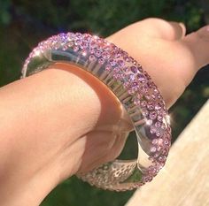 This stunning one of a kind bangle is handcrafted on transparent clear Lucite, while beautifully embellished with over 450 light rose (pink) Swarovski crystal stones. This bangle is lightweight, comfortable to wear, and is perfect for styling up with any look. Super fun to layer and stack with other bangles as well. This bangle looks even more stunning in person especially in the natural sunlight. Arrives beautifully packaged in a luxury gift box and comes included with a polishing cloth. 💎MORE Crystal Bangle Cuff Bracelet For Party, Glamorous Bangle Crystal Bracelet For Parties, Sparkling Dazzling Bracelets For Gifts, Sparkling Bracelets For Gifts, Dazzling Adjustable Bangle Bracelet, Glamorous Bangle Jewelry Gift, Glamorous Crystal Bangle Bracelet, Glamorous Bangle Jewelry For Gifts, Glamorous Sparkling Bangle Crystal Bracelet