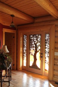 an entry way with wooden walls and flooring