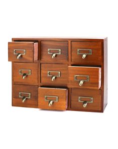 an old wooden drawer with many drawers on it's sides and brass pulls in the middle