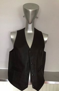 "Simple dark brown leather vest, 2 patch pockets, 4 snap front closure. Dark brown good quality leather. Great attire for musicians, stage performance etc.etc.. Great details on this piece would be the 9\" long rear darts, and the same length darts in the front, assuring a proper fitted form. I believe this is a males waistcoat/vest as it snaps close on the right side which I believe is the general rule of thumb as to whether it male or female clothing but who really cares, a woman could easily Brown Leather Vest, Who Really Cares, Kids Vest, Providence Ri, Female Clothing, Stage Performance, Leather Vest, Dark Brown Leather, Sewing Notions