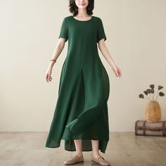 "The design of this dress is very unique, the double-layer design is more layered, the loose fit makes what kind of body can handle, and the green color is also very mysterious! Fall head over heels for the unique layered hem and adjustable fit.  FEATURES - 50% Linen, 50% cotton - Two layer, same fabric  - Short sleeve dress - Two side pockets - Round Neckline - Split hem dress - Button detail back neck line - Loose fit dress - Oversized dress - Asymmetrical dress - For Summer, spring - Dry clea Casual Long Solid Color Maxi Dress, Casual Long Maxi Dress In Solid Color, Lagenlook Midi Dress With Short Sleeves, Relaxed Fit Solid Color Maxi Dress For Summer, Lagenlook Long Green Dress, Flowy Short Sleeve Solid Color Maxi Dress, Flowy Short Sleeve Maxi Dress In Solid Color, Flowy Maxi Dress With Short Sleeves In Solid Color, Casual Solid Maxi Dress With Asymmetrical Hem