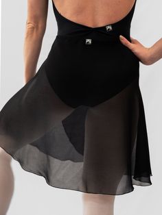 The MP339 black wrap dance long skirt is perfect for use during your rehearsals or ballet classes. Designed to complement any dancer beautifully, this ballet skirt is made of Georgette, a sheer fabric that drapes elegantly on the body. Product Details One Size Front length: 45 cm / 17.72 in Back length: 50 cm / 19.69 in Wrap skirt Press button not sewn, to be sewn based on your measurements Material: Georgette Handmade ballet skirt Made in Italy For the best care, we recommend handwashing it in cold water and allowing it to air dry. About Atelier della Danza MP's Skirts Our skirts are handcrafted using high-quality Italian fabrics. They are available in four materials: georgette, chiffon, mesh, or jersey, and come in various lengths. Explore our complete collection of both long and short s Black Sheer Flowy Skirt, Fitted Stretch Black Sheer Skirt, Black Stretch Sheer Skirt, Black Stretch Skirt With Sheer Details, Fitted Balletcore Dance Bottoms, Ballet Style Stretch Skirt For Dance, Ballet Stretch Skirt For Dance, Elegant Skirted Dance Bottoms, Dance Skirt Bottoms With Lining