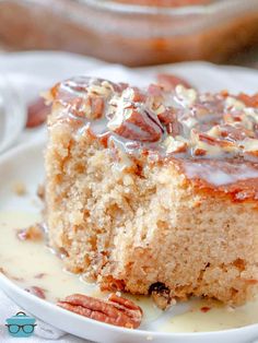 a close up of a piece of cake on a plate with caramel drizzle