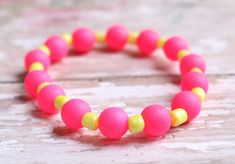 Electrified Pink and Yellow - So Bright It Glows - Girl's Child Fun Stretch BraceletYou Glow Girl! With these electrified hot pink and neon yellow beads, you'll glow for all who see. Material Used:Hot Pink Plastic Beads Bright Yellow Glass Seed Beads Nylon Stretch String Bracelets come in sizes: 5 inches and 6 inches.Handmade in Jackson Mississippi, USA.Please be aware that each product is handmade and unique. Some products are made to order. Because of this, each product may vary slightly from Jackson Mississippi, String Bracelets, Pink Plastic, String Bracelet, Pink And Yellow, Plastic Beads, Neon Yellow, Bright Yellow, Stretch Bracelet