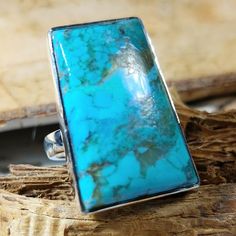 "Natural Best Grade Kingman Arizona Turquoise .925 Sterling Silver Ring Size 6 1/2 Weighs 9 Grams, Face Measures 5/8\" x 1\" GH18. Vibrant bluish green color and beautiful patterns! This is a handpicked natural stone, the exact one shown in picture. The sterling silver is .925 and stamped. Each piece is hand made by artisans in my shop. The quality of the stones and the silver workmanship is impressive. Please look at other items in my store. I sell ready-made jewelry with hand crafted silver work, pendants with a sterling silver bails and beautiful unique cabochons for jewelry wire wrapping and weaving. You will pay exact amount on shipping plus $1 for supplies and labor. All items are shipped within a couple of days after payment and are shipped USPS first class or international first cl Unique Rectangular Turquoise Ring, Handmade Turquoise Rectangular Rings, Rectangular Turquoise Gemstone Ring, Rectangular Blue Turquoise Gemstone Ring, Rectangular Turquoise Ring For Anniversary, Anniversary Rectangular Turquoise Ring, Kingman Arizona, Ring Turquoise, Arizona Turquoise