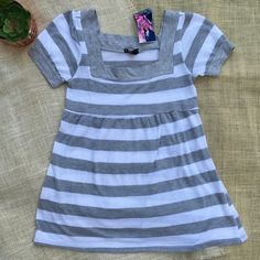 Brand New, But Missing Some Of The Tags. 50% Polyester, 50% Rayon Juniors Size Large. Adorable Gray And White Striped Baby Doll Sweater. Super Soft Knit Fabric. Square Neckline And Ties In The Back. Approximate Measurements Flat And Unstretched: Underarm To Underarm, 15" Length, 26" Striped Cotton Top For Playwear, Striped Short Sleeve Tops For Playwear, Striped Tops For Playwear In Spring, Striped Tops For Spring Playwear, Trendy White T-shirt For Playwear, Casual White Tops For Playwear, Trendy Stretch Tops For Playwear, Trendy Cotton Tops For Playwear, Trendy White Top For Playwear