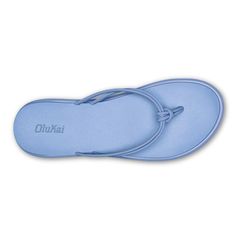 two pairs of blue slippers with the word oki on them