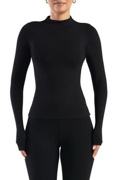 Buttery-soft fabric lends an indulgent feel to this stretchy, long-sleeve top crowned with a mock neck. 21 1/2" length (size Medium) Mock neck Long sleeves Partially lined 87% rayon, 13% spandex Hand wash, line dry Made in the USA Long Sleeve Tops With Thumbholes, Long Sleeve Tops With Thumbholes And Minimal Stretch, Long Sleeve Top With Thumbholes And Minimal Stretch, Elastane Long Sleeve Top For Layering, High Stretch Tops With Thumbholes For Winter, Second-skin Crew Neck Tops With Thumbholes, Winter Stretch Tops With Thumbholes, High Stretch Winter Tops With Thumbholes, Winter Tops With Thumbholes And High Stretch