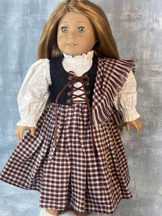 Traditional Scottish Tartan dress for your girl doll. This outfit has a dress with a zipper closure in the back, a jacket with lacing grommets and a shawl. Made in my smoke and pet free sewing shop, all edges are neatly finished and serged, bringing you the finest quality doll clothes.    Fits just about any 18" sized doll.     Made in the USA, doll not included. Sewing Shop, Tartan Dress, Scottish Tartans, Doll Clothing, Free Sewing, Girl Dress, Girl Dolls, American Girl, Doll Toys