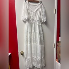 This Dress Has A Bit Of A Vneck With A Floral Lace Detail. The Dress Does Come With Sleeves That Reach The Elbow. V-neck Maxi Dress With Lace Trim, Casual V-neck Maxi Dress With Lace Trim, Summer Lace V-neck Maxi Dress, Summer Lace Maxi Dress With V-neck, Summer V-neck Lace Maxi Dress, Casual Lace V-neck Maxi Dress, White Floral Lace Dress, Floral Lace Dress, Lace Detail