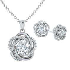 Exquisite symbols of love… This stunning silver-plated pendant features a Diamonisse simulated diamond solitaire at its center, accented by more sparkling simulated diamonds.Included in this very special offer, are perfectly matching earrings!This glittering and exceptional set features the incomparable radiance of over 85 stones and is sure to bring compliments galore, wherever it's worn.A sumptuous presentation pouch — perfect for gift-giving and safekeeping — and a matching 18" ch Cubic Zirconia Jewelry Sets For Anniversary, Fine Jewelry Set With Sparkling Stones For Anniversary, Silver Cubic Zirconia Jewelry Sets For Anniversary, Anniversary Jewelry Sets With Cubic Zirconia Round Cut, Silver Diamond Cut Jewelry Sets For Anniversary, White Gold Jewelry Sets With Sparkling Stones For Anniversary, Dazzling White Gold Jewelry Sets For Anniversary, Diamond Jewelry Sets For Anniversary, Silver Diamond Jewelry Sets For Anniversary