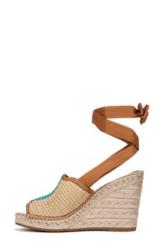 A double layer of braided jute adds tropical lift to a boho leather sandal detailed with tiny gleaming studs on the heel straps. 2" heel; 1 1/4" platform (size 8.5) Adjustable strap with hook-and-loop closure Leather upper/synthetic lining and sole Imported Women's Shoes Bohemian Wedge Heel Sandals For Summer, Natural Wedge Sandals With Woven Sole And Round Toe, Adjustable Wedge Heel Espadrilles, Ankle Strap Heels With Removable Insole For Beach, Beach Heels With Removable Insole And Ankle Strap, Beach Heels With Heel Strap And Round Toe, Vacation Jute Espadrilles With Round Toe, Summer Beach Wedge Sandals With Heel Strap, Bohemian Beige Wedge Sandals For Summer