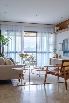 the living room is clean and ready for guests to use it as a dining area