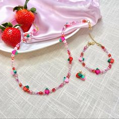 Handmade Pink “Strawberry Shortcake” Necklace, Bracelet, And Earrings Set. Necklace Is Approximately 18” Length. Bracelet Is Approximately 7” Length. Both Necklace And Bracelet Are Adjustable, As They Have An Extender. Crafted With 18kt Gold Plated Clasps And Nylon Coated, Stainless Steel Wire. Nickel Free. Check Out @The Serotonin Supply On Etsy & Link In Bio For More! Pink Strawberry Shortcake, Strawberry Charm, Butterfly Necklace Gold, Beaded Jewelry Necklaces, Fruit Jewelry, Pink Strawberry, Braided Necklace, Beads Bracelet Design, Set Necklace