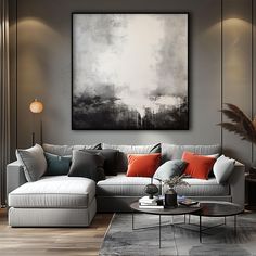 a living room filled with furniture and a painting on the wall