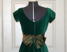 "Vintage 1950s Kay Selig Velvet and Satin party dress. This is truly a fashion for the ages! Colors: Green Style:3020 Size: 12 Measurements: (taken flat) Shoulder to Shoulder: 14\" Bust: 16\" Waist: 14\" Length Shoulder to Hem: 44.25\" Please measure a dress that fits you to use as a size comparison as vintage sizes are smaller that sizes today. Label: Kay Selig New York Care Instructions: Dry Clean Only. Do Not Use Petroleum Solvents or Coin Operated Method of Dry Cleaning. Have any questions? 1950s Style Dress With Fitted Bodice For Formal Events, 1950s Style Dress With Fitted Bodice For Formal Occasions, 1950s Style Formal Dress With Fitted Bodice, Retro Formal Dress With Fitted Bodice, 1950s Style Fitted Formal Dresses, Fitted Dresses In 1950s Style For Formal Occasions, 1950s Style Fitted Party Dress, 1950s Style Green Formal Dress, Classic Fitted Vintage Dress For Parties