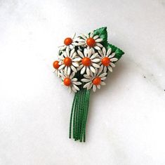 "This is a vintage painted metal flower bouquet brooch.  The flowers are white daisies with yellow centers.  The stems and leaves are green.  The pin back is secure.  Unsigned.  This brooch measures 3\" long x 2 1/8\" wide. This is a vintage, previously owned brooch.  Therefore, light wear can be expected.  There is no visible damage." Vintage White Flower Enamel Pin, Vintage White Flower Brooches, Vintage White Flower Pins, White Vintage Flower Brooches, White Flower Enamel Pin For Wedding, Vintage White Flower Brooch, Broche Bouquet, Bouquet Brooch, Daisy Bouquet