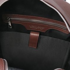 The perfect go-anywhere backpack! Handcrafted in Italy using rich vegetable-tanned, hand-stained, hammered calfskin leather. Features two main compartments, inside zip pocket and one open pockets, one padded compartment, two opened back pockets, front pocket with closure, leather handle, adjustable padded shoulder straps, nickel hardware, soft structure, polyester lining. Dust bag included. External Dimensions: 11.81" Length x 16.14" Height x 8.07" Depth Internal Dimensions: width: 11.02", height: 14.96", depth: 5.12" Weight: 3.75 Lbs Shoulder strap length (min): 21.26", Shoulder strap length (max): 37.8" Hammered Calfskin Leather Handcrafted in Tuscany, Italy TL142333 Ships from Italy 10 character (includes spaces) customization available Our Italian bags, wallets and accessories are ship Brown Travel Backpack With Smooth Grain, Classic Brown Leather Backpack With Zipper Closure, Classic Brown Backpack With Zipper Closure, Luxury Leather Backpack With Zipper Pocket For On-the-go, Travel Backpack With Smooth Grain In Brown, Brown Smooth Grain Travel Backpack, Luxury Leather Backpack With Zipper For Daily Use, On-the-go Smooth Grain Leather Backpack, Brown Luxury Backpack