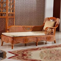 a living room filled with furniture and rugs on the floor next to a wall