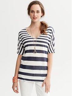 Striped Dolman-Sleeve Shirt Striped V-neck Shirt For Summer, Chic White V-neck T-shirt, Chic Striped T-shirt For Summer, Chic Oversized Striped Top, White V-neck T-shirt For Day Out, Spring Striped V-neck Shirt, Oversized V-neck Shirt For Summer, Elegant V-neck T-shirt For Summer, Chic V-neck T-shirt For Fall