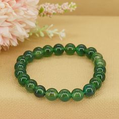 Step into a world of rejuvenation and abundance with our Emerald Jade Bracelet, a symbol of growth, renewal, and prosperity. Crafted from exquisite emerald jade beads, this bracelet serves as a reminder to embrace the endless possibilities of new beginnings and to manifest abundance in all areas of your life. * High-Quality Beaded Bracelet* Unisex Bracelet* 8mm beads* Made to Fit Your Wrist or Anklet* Made with Pure Positive Energy* Great Gift for Everyone Spiritual Jade Crystal Bracelet For Meditation, Holistic Jade Bracelets With Gemstone Beads, Holistic Jade Bracelet With Gemstone Beads, Holistic Hand-strung Jade Jewelry, Green Jade Jewelry For Meditation, Green 8mm Beads Bracelets As Gift, Hand-strung Jade Crystal Bracelet For Meditation, Green Hand-strung Bracelet For Meditation, Green Spiritual Bracelets For Healing