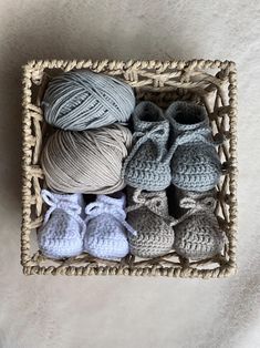 crochet baby booties and slippers in a basket