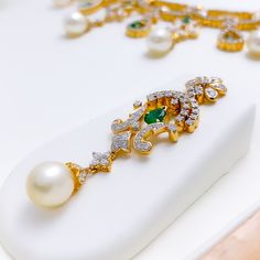 PRODUCT DETAILS Gold Purity(karat): 18k Item Weight(grams): 73.8 Item Finish: Yellow Gold Stone: Diamond Diamond Weight(carats): 9.27 ct Pearl weight (carats): 42.14 Emerald weight (carats): 3.14 Diamond Color: F-G Diamond Quality: VS Set Length: 15" Drop Length: 1.8" Lock Style: Hook Lock Adjustable Links: 2.1" Matching Earrings: Included Earring Length: 2.1" Earring Post: ﻿Screw Back Luxury Yellow Gold Emerald Necklace For Wedding, Elegant Hand-set Emerald Necklace In Yellow Gold, Elegant Yellow Gold Hand Set Emerald Necklace, Traditional Yellow Gold Emerald Necklace For Formal Occasions, Traditional Yellow Gold Emerald Necklace For Formal Events, Luxury Green Jewelry With Pearl Drop, Elegant Yellow Gold Emerald Necklace For Wedding, Luxury Diamond Necklace With Emerald In Gold Setting, Luxury Gold Emerald Necklace With Diamond Accents