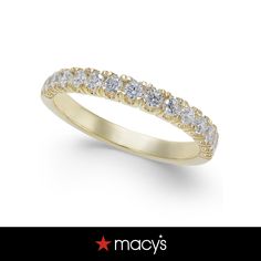 a yellow gold wedding ring with five diamonds on the side and an inscription that reads macy's