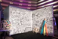 the room is decorated with black and white doodles