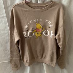 Disney Winnie The Pooh Oversized Sweatshirt *New Without Tags (Bought Last One At Store, No Tags), Unworn *Size Medium (Oversized Fit) *Color: Tan *Disney Winnie The Pooh Screen Printed And Embroidered Graphic Detail *Round Neckline *Long Sleeve *Fleece Lined Interior *Materials: Polyester, Cotton Disney Long Sleeve Tops For Fall, Oversized Casual Sweatshirt With Character Print, Disney Long Sleeve Relaxed Fit Top, Disney Style Long Sleeve Tops With Relaxed Fit, Disney Tops With Relaxed Fit And Long Sleeve, Disney Letter Print Top For Fall, Disney Tops For Streetwear In Fall, Disney Style Top For Fall Streetwear, Disney Graphic Print Sweatshirt For Fall