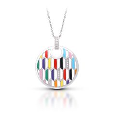 Trapezio by Belle Étoile is a rainbow of geometric style. Featuring hand-painted Italian enamel on pavé-set sterling silver, Trapezio delights the eye with chromatic textures and layers and perfectly complements any ensemble. Description: Hand-painted multicolored Italian enamel with white stones set into rhodium-plated, nickel allergy-free, 925 sterling silver. *Chain not included. Click here to view our available chains. VP-17044-01 Dimensions: 29.67mm width by 35.58mm height Luxury Multicolor Enamel Jewelry, Modern Round Rainbow Jewelry, Modern Rainbow Round Jewelry, Modern Multicolor Geometric Jewelry, Fusion Multicolor Enamel Jewelry, Modern Silver Enamel Necklace, Modern Multicolor Enamel Jewelry, Modern Multicolor Sterling Silver Jewelry, Enamel Pendants