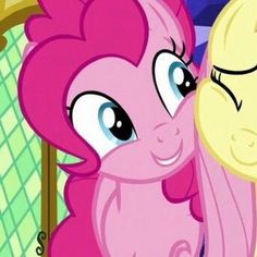 two pinkie ponies standing next to each other