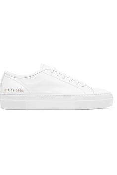 Pristine white sneakers are an essential in any wardrobe - they go with everything from jeans to dresses. Made in Italy, Common Projects' leather 'Tournament' pair is set on a chunky rubber sole. The signature serial numbers mark the label's meticulous attention to detail. Wear it with: Joseph Pants, Alighieri Ring. -- Rubber sole measures approximately 40mm/ 1.5 inches - White leather (Calf) - Lace-up front - Made in Italy White Lace-up Platform Sneakers With Leather Sole, Classic Custom High-top Sneakers For Everyday, Classic High-top Custom Sneakers For Everyday, Modern High-top Sneakers With Lug Sole, Classic Low-top Platform Sneakers With White Sole, Classic White Platform Sneakers For Streetwear, Classic Everyday Custom Sneakers With Contrast Sole, Classic High-top Sneakers With Leather Sole For Streetwear, Classic Leather-sole High-top Sneakers For Streetwear