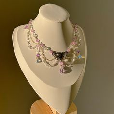 ✧*̥˚ 𝑀𝑜𝓅𝒽𝒶 𝐿𝒾𝓁𝒶 *̥˚✧ Layered with silver chain, this intricate necklace is handmade with purple and clear crystal beads, delicate water drop beads, and a silver moth charm. Accented with mini purple butterflies and chains of crystal beads, the elements of this piece balance each other in complexity and elegance, making the "Mopha Lila" necklace a perfect statement piece for any special occasion! ੈ♡˳ Handmade with love and attention ੈ♡˳ Delicate selection of beads and charms, carefully a Beaded Drop Crystal Necklaces As Gift, Crystal Necklaces With Silver Beads As Gift, Crystal Necklaces With Silver Beads For Gift, Silver Fairycore Crystal Necklaces For Jewelry Making, Crystal Beaded Necklaces With Dangling Beads For Gifts, Silver Beaded Teardrop Crystal Necklace, Crystal Necklaces With Silver Beads For Jewelry Making, Silver Pendant Crystal Necklace With Beaded Chain, Silver Crystal Necklaces With Dangling Beads As Gift