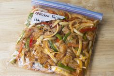 a bag of chicken fajita salad on a wooden table with a price tag