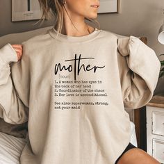 Mother Definition Sweatshirt, Blessed Mom Sweatshirt,Mothers Day Gifts,New Mom Sweater,Birthday Mom Gifts,Mothers Day Sweat,Retro Mom Gifts  **Product Details** - Crafted from a blend of 50% Cotton and 50% Polyester for optimal comfort and durability. - Medium-to-heavy weight fabric ensures long-lasting wear. - Tear-away label for added convenience. - Offers a loose, comfortable fit while maintaining true-to-size proportions. **Ordering Process** 1. Review product photos and sizing information a Mother's Day Birthday Graphic Print Sweatshirt, Graphic Print Sweatshirt For Birthday And Mother's Day, Mother's Day Crew Neck Sweatshirt With Lettering, Mother's Day Lettering Crew Neck Sweatshirt, Mother's Day Birthday Crew Neck Sweatshirt, Casual Sweatshirt For Birthday And Mother's Day, Mother's Day Graphic Print Sweatshirt, Mom Sweater, Mom Sweatshirt