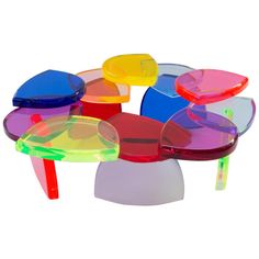 a multicolored plastic table with several different shapes and sizes on the tables top