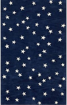 a blue rug with white stars on it